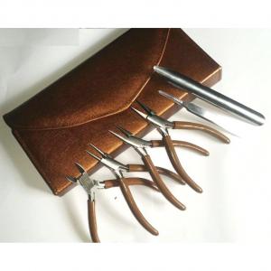Purse with 6 tools brown colour.
